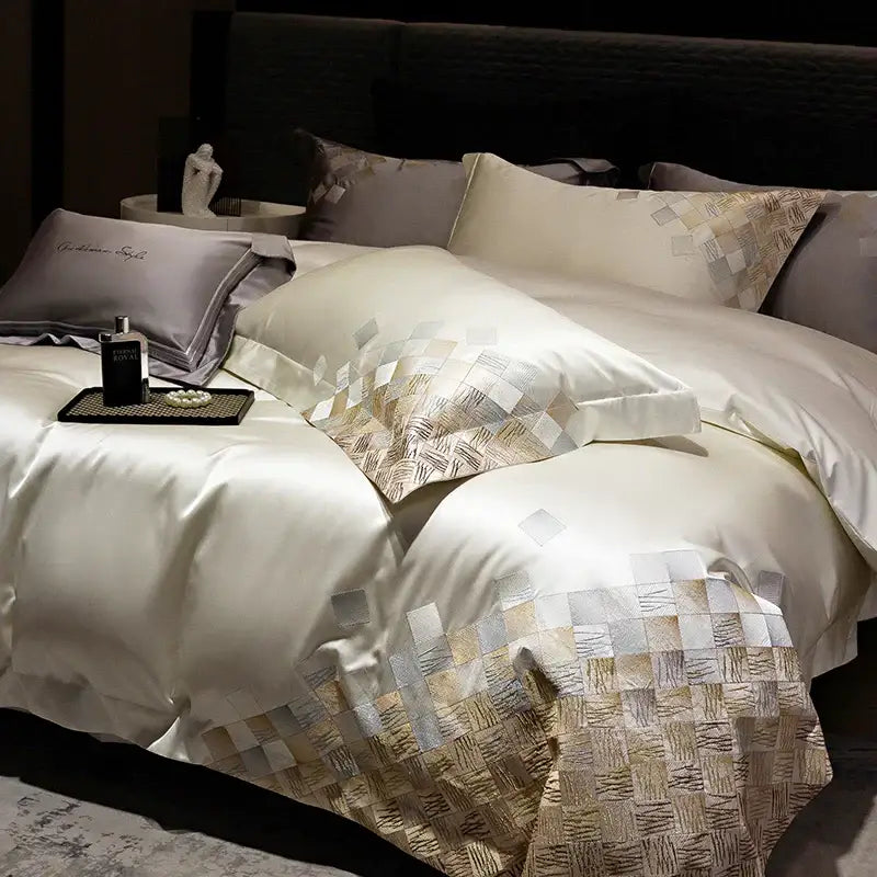 Cream satin duvet cover with gold and silver geometric embroidery along edge in luxury embroidery bedding set pearl white gray