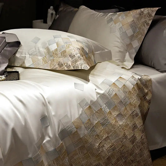 Elegant luxury embroidery bedding set in pearl white featuring white satin duvet cover and metallic geometric pattern