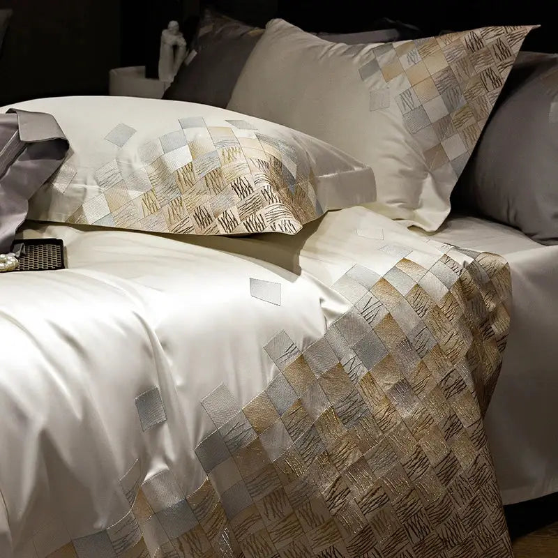 Elegant luxury embroidery bedding set in pearl white featuring white satin duvet cover and metallic geometric pattern