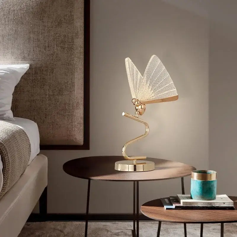 Luxury gold butterfly floor lamp with delicate mesh wings and curved metallic base for elegant living room decor