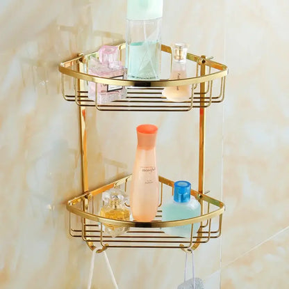 Gold-colored two-tiered corner bathroom shelf with wire mesh design from decorbites brass crystal bathroom set