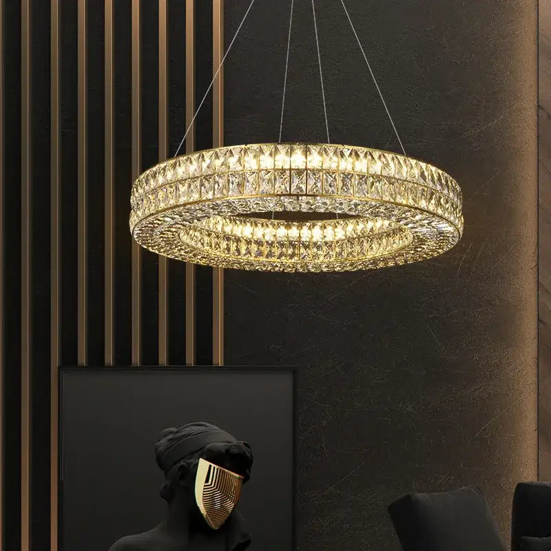 Luxury gold crystal circle pendant chandelier featuring gold-toned double rings with faceted crystal decorbites crystal circle design