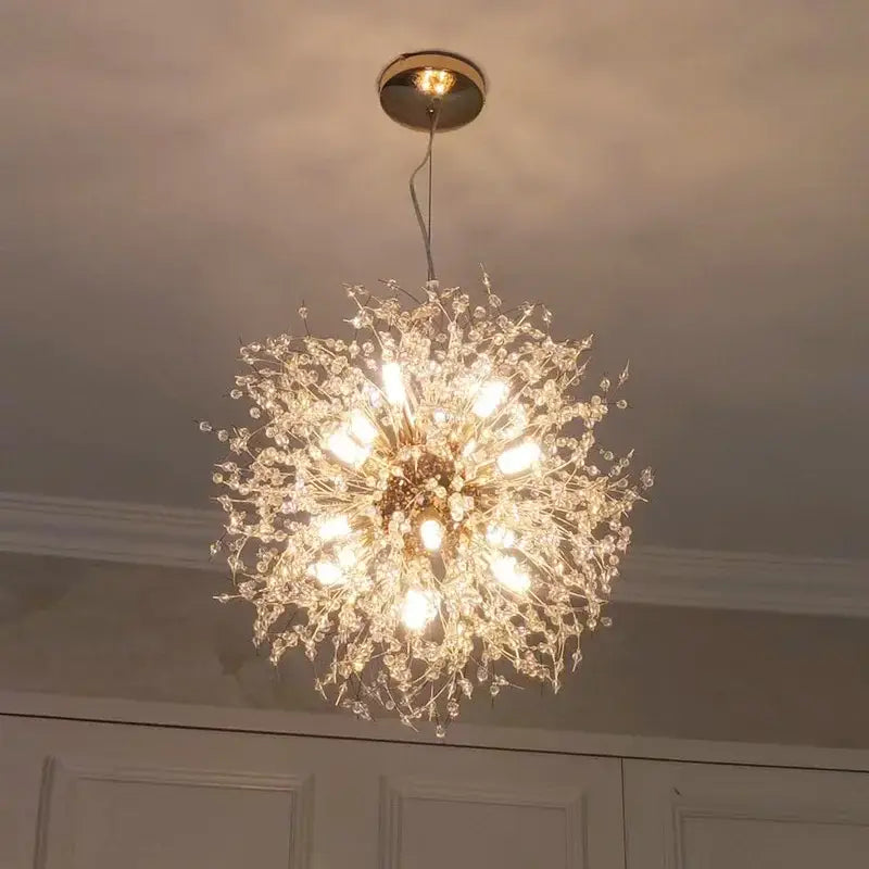 A luxury gold-toned decorbites dandelion chandelier with intricate crystal branches and multiple illuminated bulbs for living room light