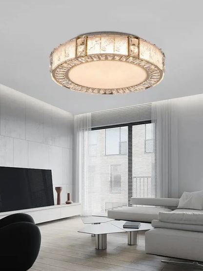 Luxury gold crystal glass chandelier with a circular frame and faceted panels for glass luxury ceiling decorbites