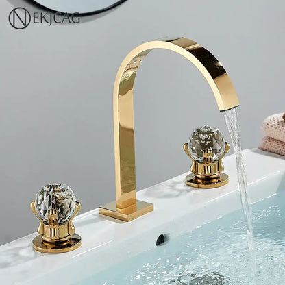 Luxury gold crystal handle basin faucet with decorbites crystal handles and a sleek arched spout for bathroom use