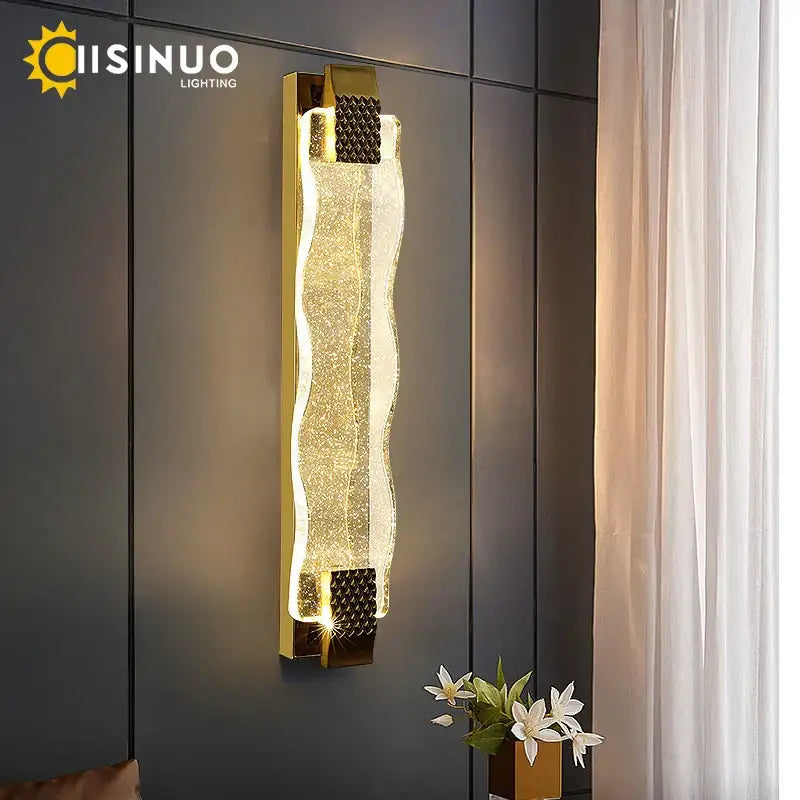Luxury gold wall sconce with textured wavy glass and diamond-patterned metal accents decorbites crystal led wall light