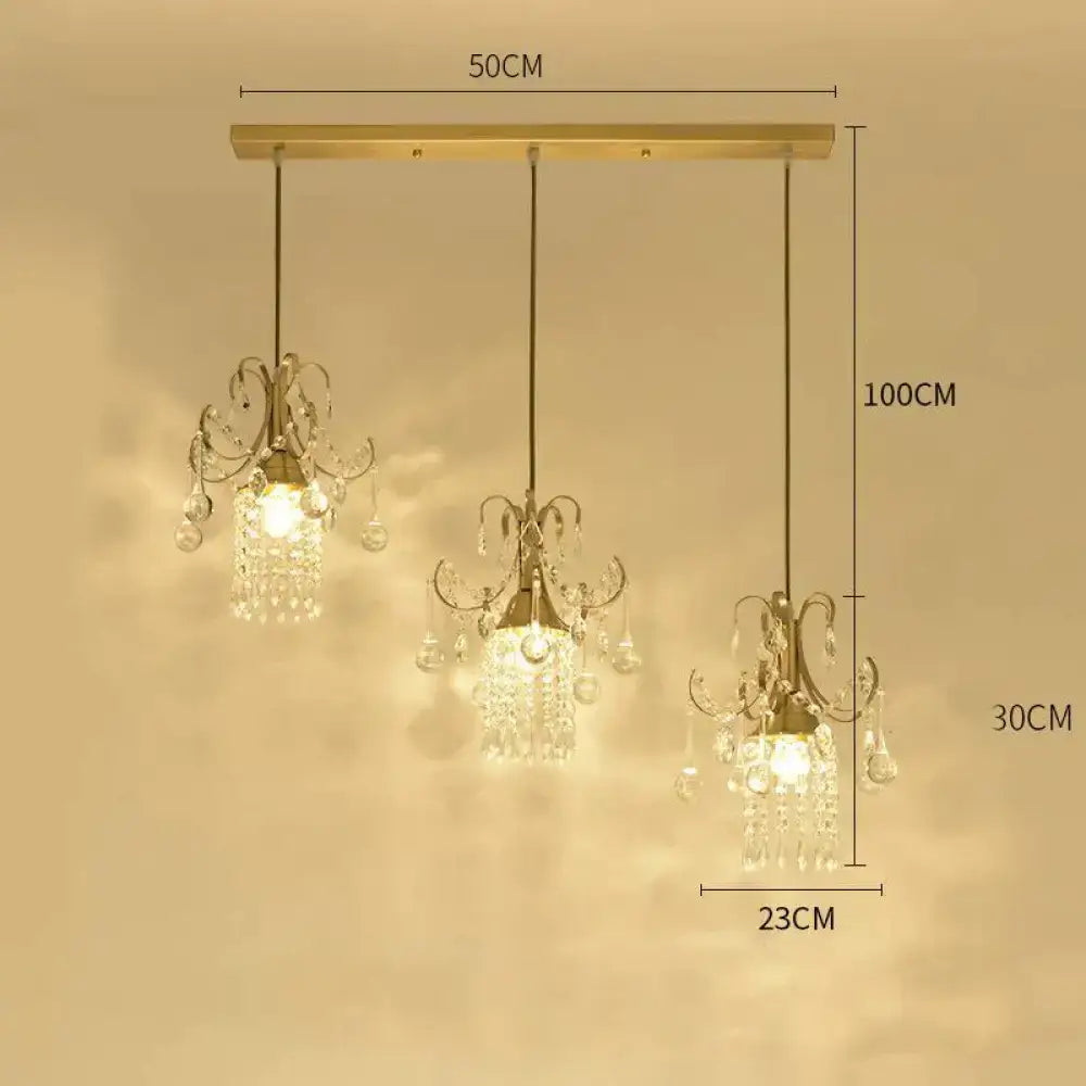 Gold-toned decorbites luxury single head pendant light with crystal droplets and ornate metalwork for dining room use
