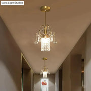 Gold-finished DecorBites™ luxury single head pendant light with crystal droplets and glass shade for dining room use