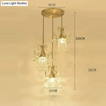 Gold-toned luxury single head pendant light with three crystal-encrusted lights for dining room by DecorBites