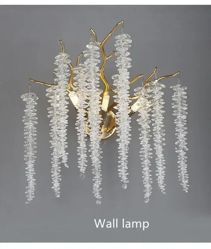 Elegant gold crystal tassel chandelier featuring cascading clear faceted beads in a tree branch design for living room decor
