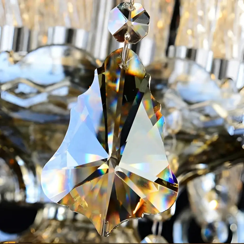Luxury gold crystal wall lamp pendant with faceted teardrop droplets featuring iridescent rainbow reflections for luxury bedroom lighting