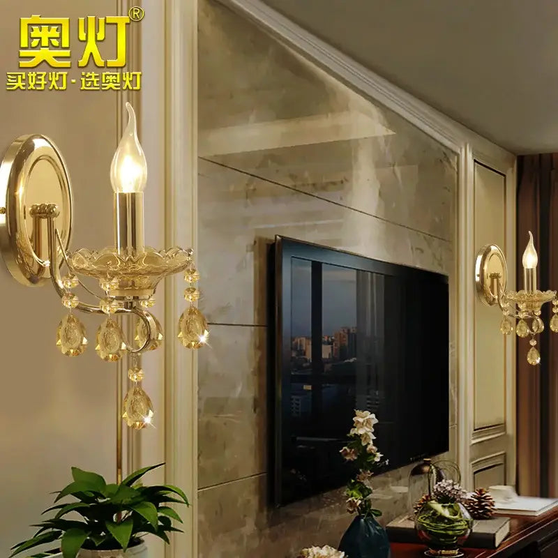 Luxury gold crystal wall sconce with candle bulb and amber teardrop crystals from decorbites crystal chandeliers