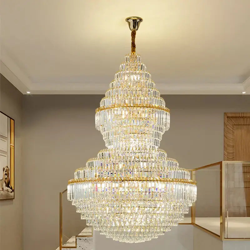 Luxury gold decorbites crystal hollow chandelier with multi-tiered clear glass prisms for elegant living room lighting