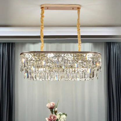 A luxury decorbites crystal led chandelier with a rose gold frame and twisted golden chains for living room