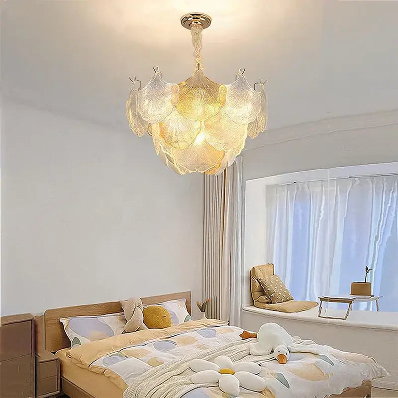 Luxury gold glass shell ceiling pendant light with layered translucent petal shades and polished brass fixture for bedroom