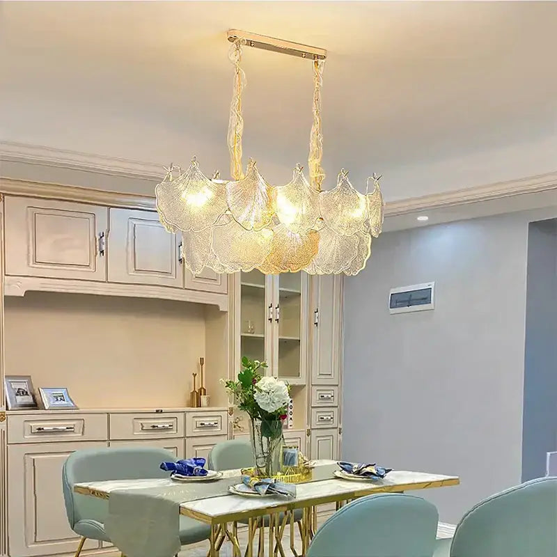 Luxury gold glass shell ceiling pendant light featuring a delicate translucent glass chandelier with golden frame and chains