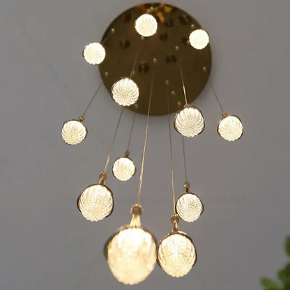 Luxury gold led staircase chandelier with textured glass globes in gold tone for living room decorbites gold led lighting