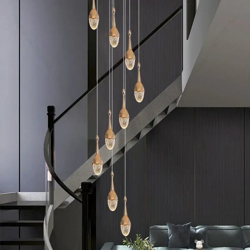 Luxury gold led staircase chandelier with teardrop-shaped crystal pendant lights for elegant living room decorbites gold led