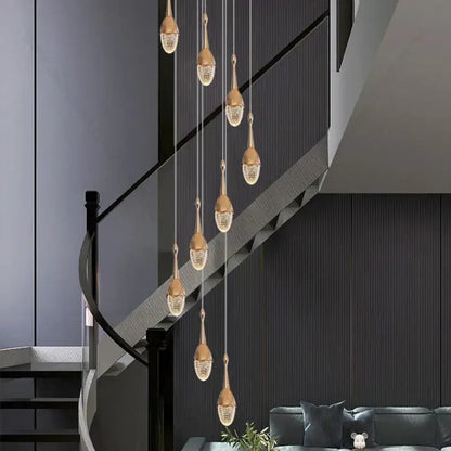 Luxury gold led staircase chandelier with teardrop-shaped crystal pendant lights for elegant living room decorbites gold led