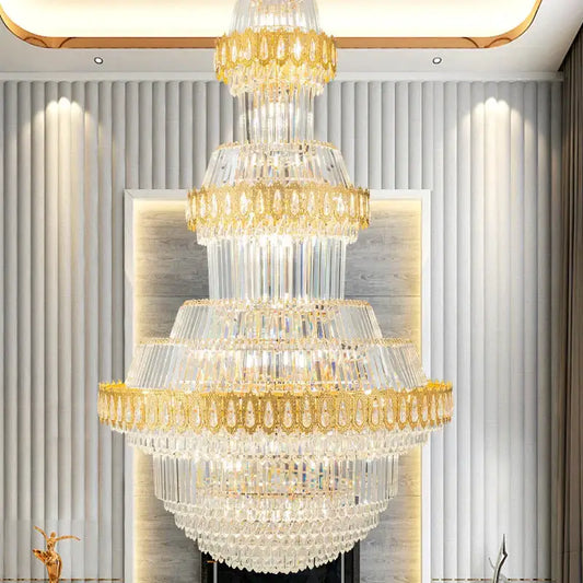 Luxury gold multi-tiered decorbites crystal chandelier with cascading clear glass prisms for living room decor