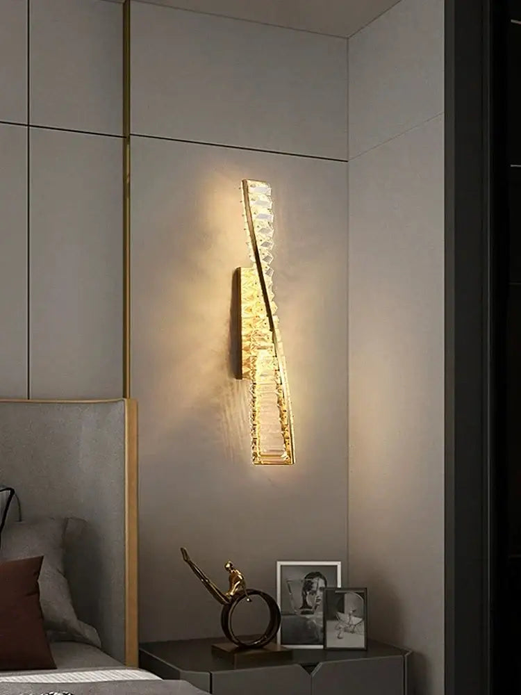 Luxury golden twisted crystal led wall sconce with gold tone and crystal accents emitting warm light for bedroom decorbites crystal led wall