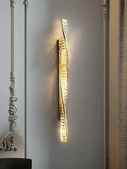 Luxury golden twisted crystal led wall sconce with decorbites crystal led accents emitting warm bedroom light