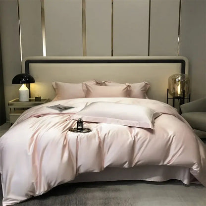 Luxurious blush pink satin duvet bedding set with matching pillowcases featuring a smooth glossy finish and elegant folds