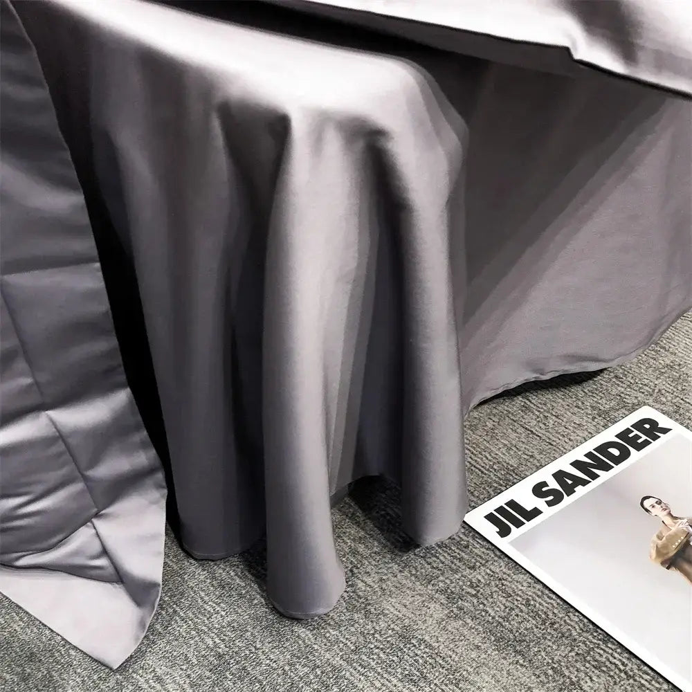 Luxury gray egyptian cotton bedding set featuring a sleek dark gray satin tablecloth with a smooth flowing drape