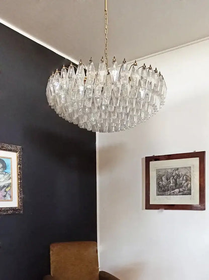 A decorbites gray glass chandelier with faceted smoked crystal and gold metal frame for dining room lighting