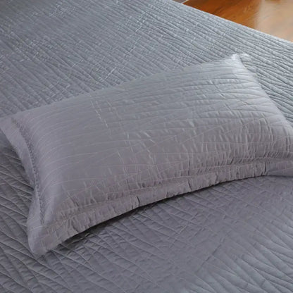 Gray quilted pillow with subtle diagonal stitching from luxury gray textured egyptian cotton quilt set for bedroom bedding