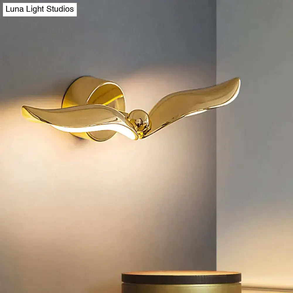 Golden sleek luxury minimalist creative seagull wall lamp with metallic finish for bedroom and living room decor