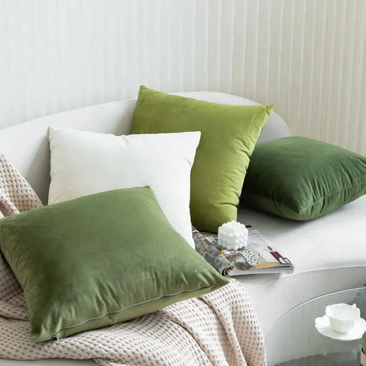 Soft olive green velvet pillow case with subtle sheen on white sofa enhances decorbites green velvet pillow decor