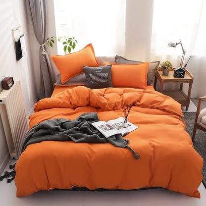 Luxury orange and gray duvet cover set with matching pillows and gray throw blanket for bedroom bedding