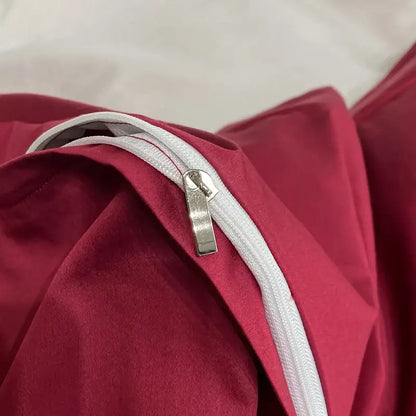 Luxury pink and cream egyptian cotton flower bedding set featuring a white zipper with a silver pull on red fabric