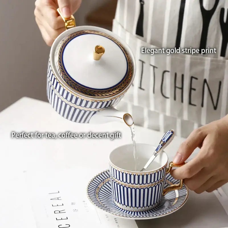 Elegant porcelain teapot and cup set with blue stripes gold trim and ornate handles from decorbites gold porcelain collection