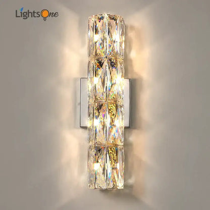 Luxury silver crystal deluxe wall sconce with faceted clear glass segments on a sleek metal plate for living room decorbites