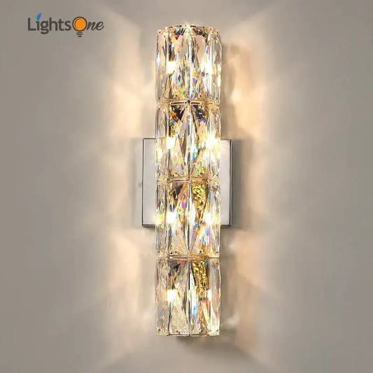 Luxury silver crystal deluxe wall sconce with faceted clear glass segments on a sleek metal plate for living room decorbites