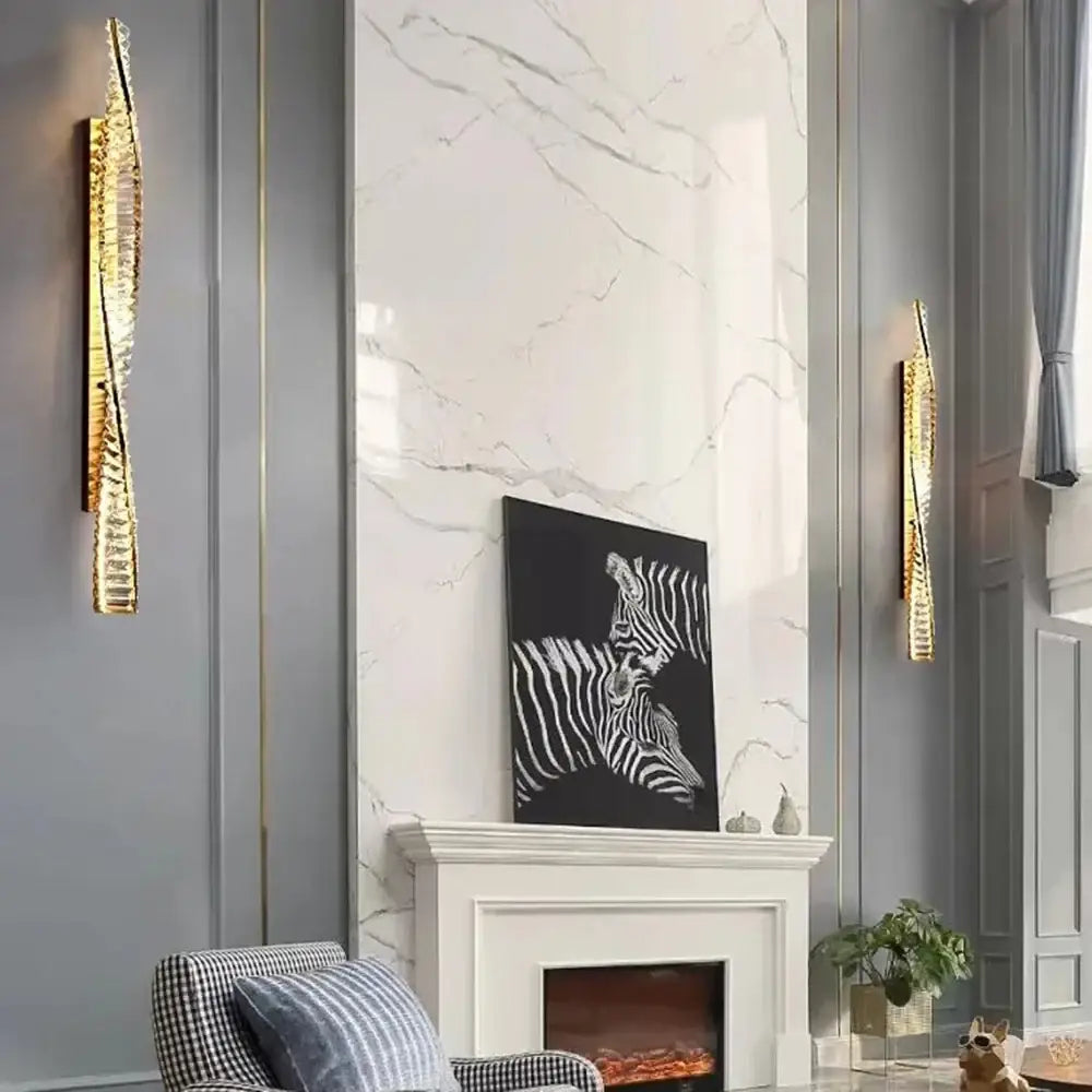 Luxury textured decorbites crystal gold wall lamp with elongated design flanks marble fireplace in living room decor