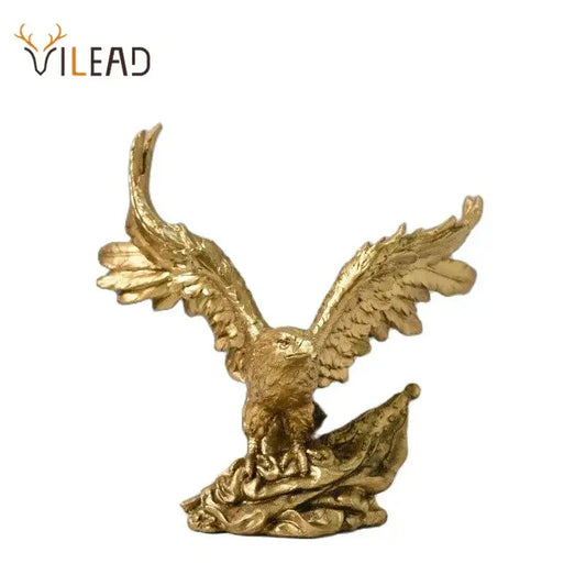 Majestic gold resin eagle sculpture with detailed feathered wings spread wide perched on textured base for decor