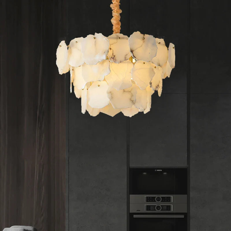 Modern marble led chandelier round pendant light with off-white petal glass pieces on a twisted gold chain