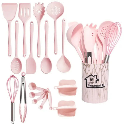 Pink silicone cooking tool set with marble-patterned storage container for kitchen organization and use