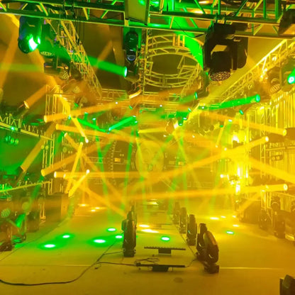 A matte black 150w mini led moving head stage light projecting vibrant green and yellow lasers in a party room setup