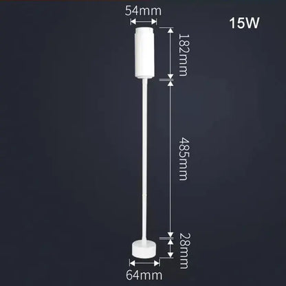 White cylindrical led floor lamp with precise dimensional markings paired with matte black decorbites adjustable beam track light for task lighting