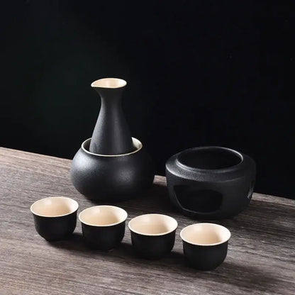 Matte black and light blue decorbites ceramic sake set with cream interior and matching warming pot for dining room use