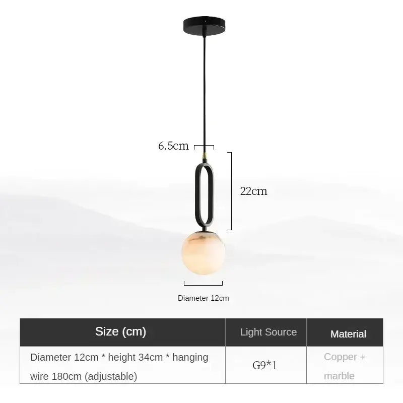 Matte black and polished copper pendant light with a sleek frame and warm amber marble globe for dining room use