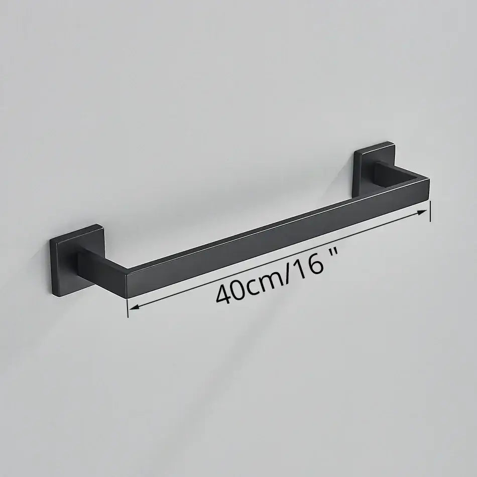 Matte black bathroom accessories set featuring a black matte-finished metal towel rack with square mounting plates