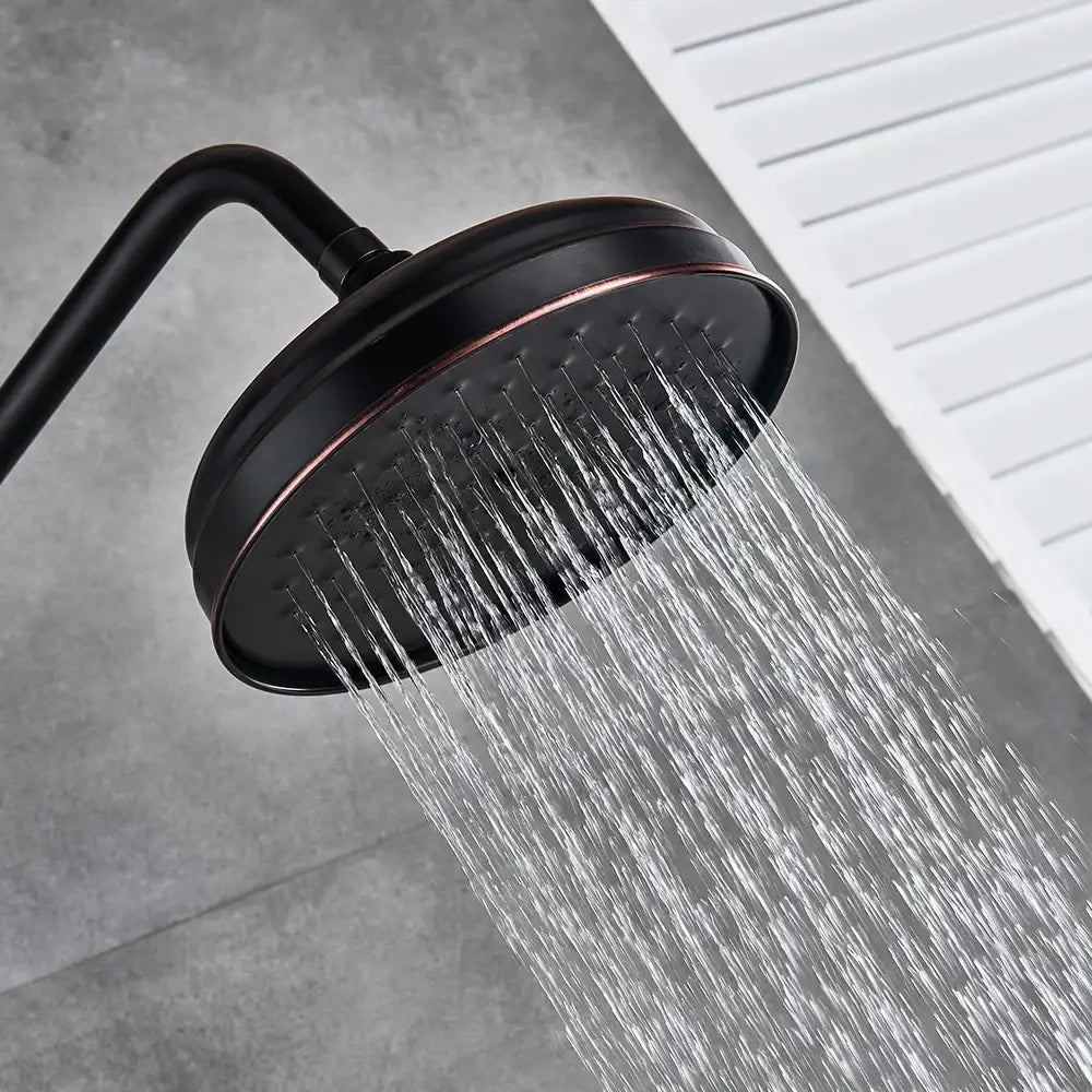 Matte black and bronze shower faucet set with a black matte finished showerhead featuring a copper-toned rim and multiple jets
