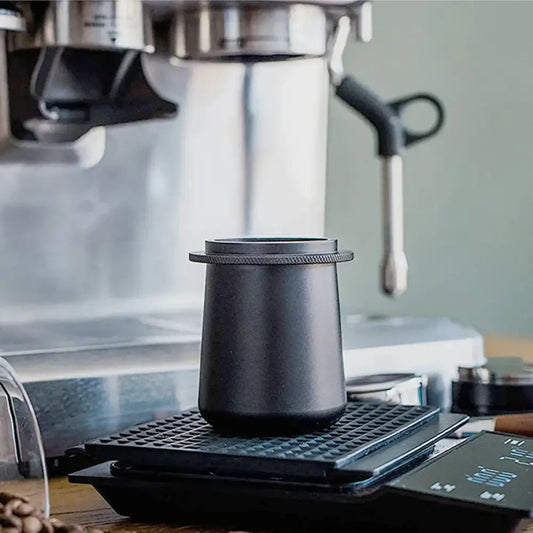 Matte black ceramic dosing cup with a ridged rim for espresso machine dosing by decorbites espresso machine