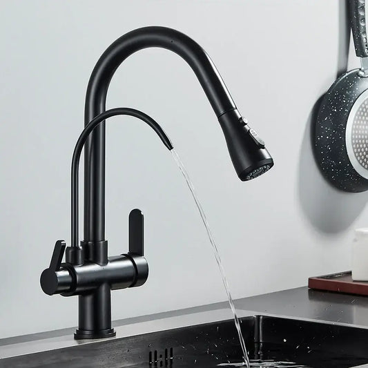 Black kitchen faucet with water flowing into a sink against a light gray wall.