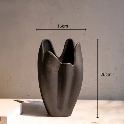 Dark gray irregular pleated ceramic vase with a tulip-like sculpted form for modern decorbites irregular pleated decor